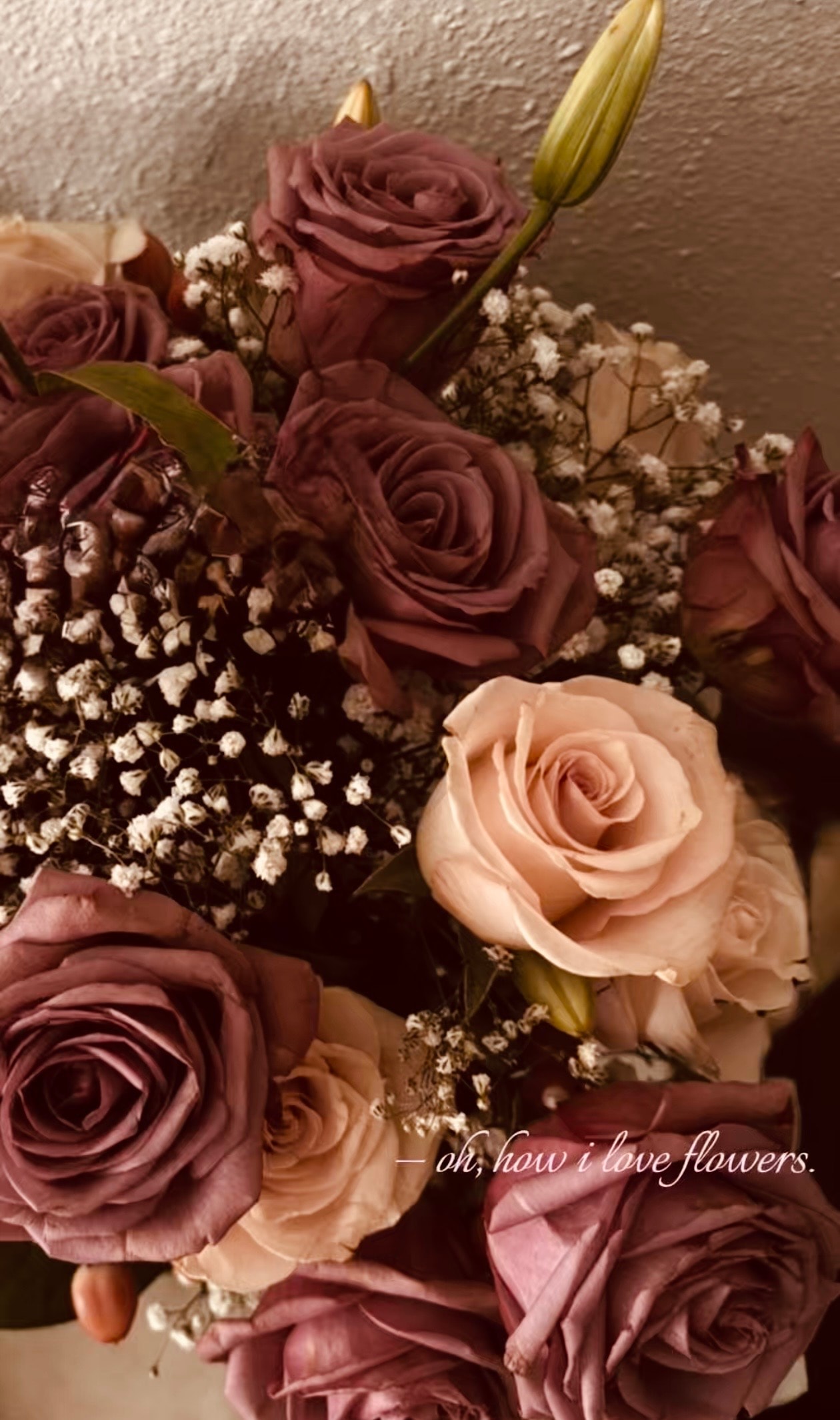Florist's hands arranging a fresh craft bouquet in the workshop