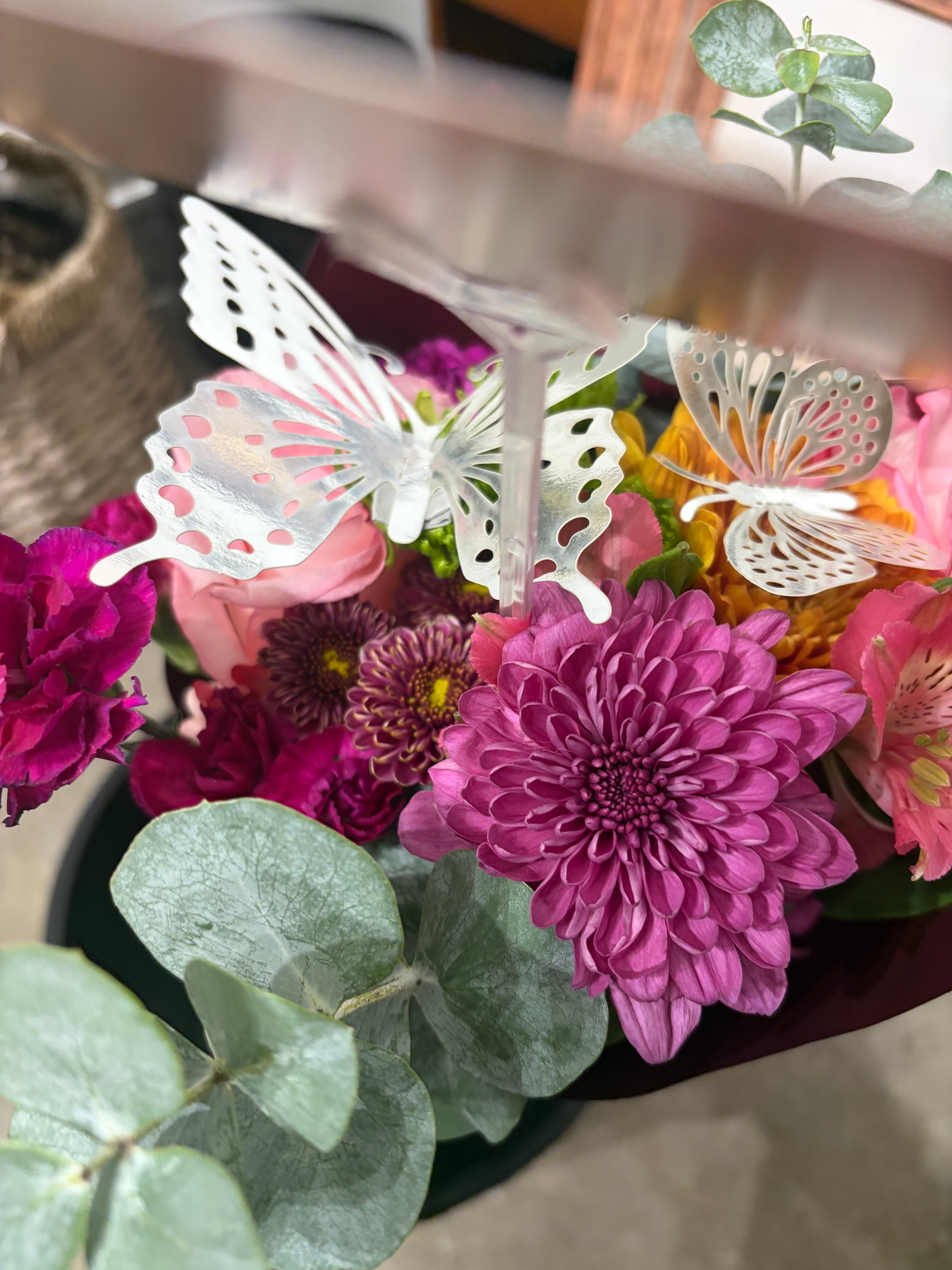 Flower bouquet with white butterfly decorations