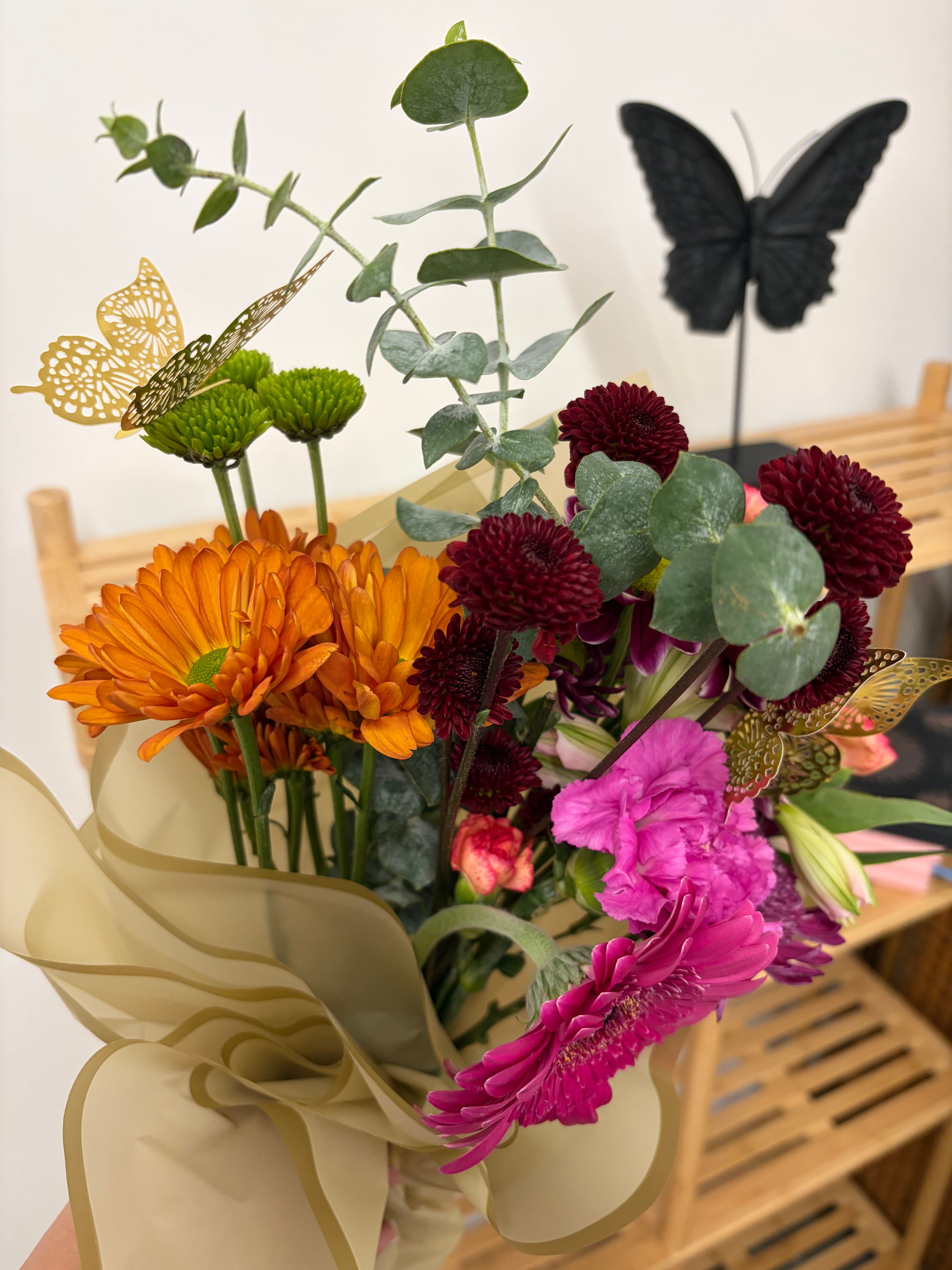 Colorful chrysanthemum bouquet with butterfly decorations