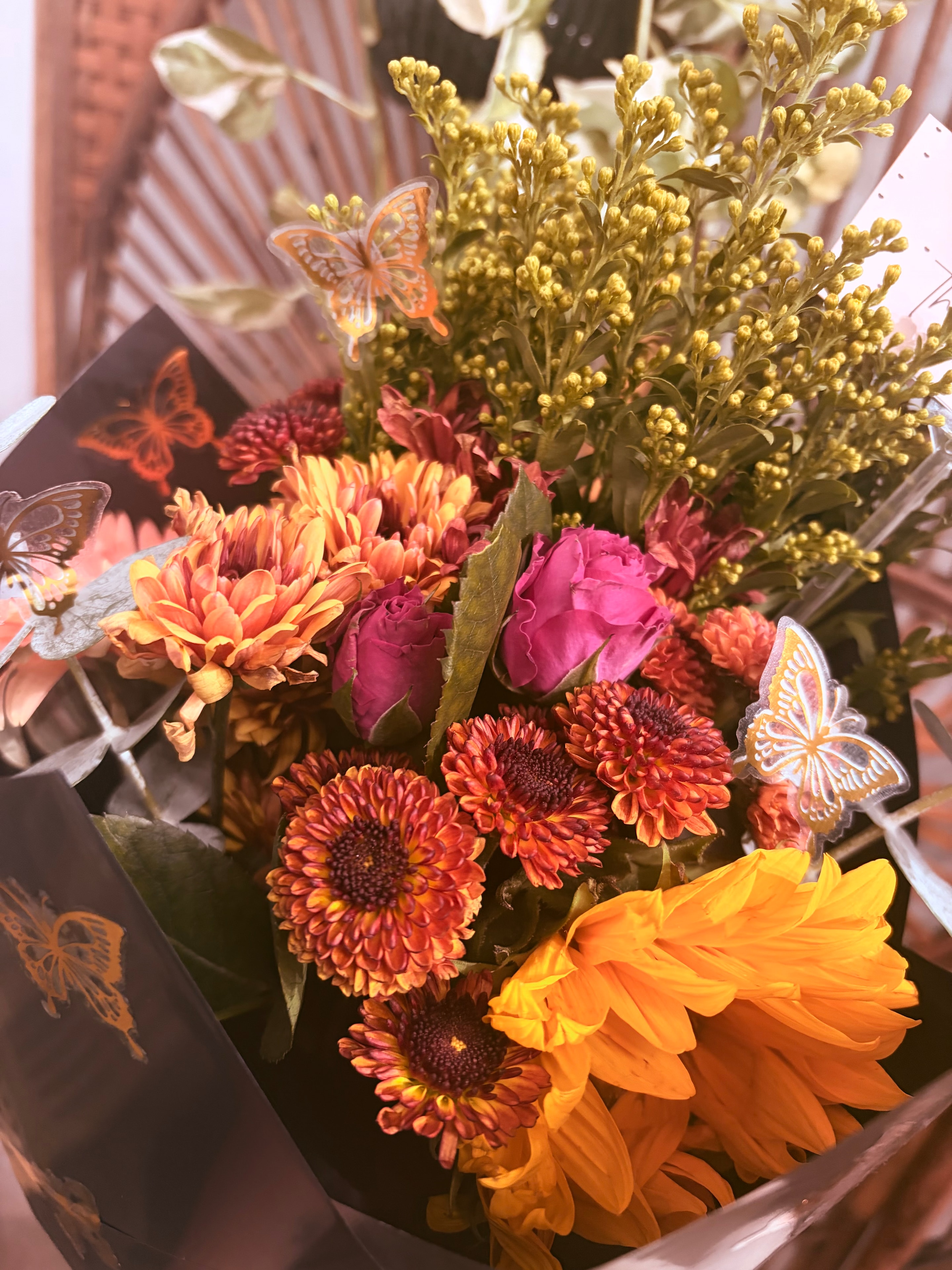 Autumn flower bouquet with butterfly decorations