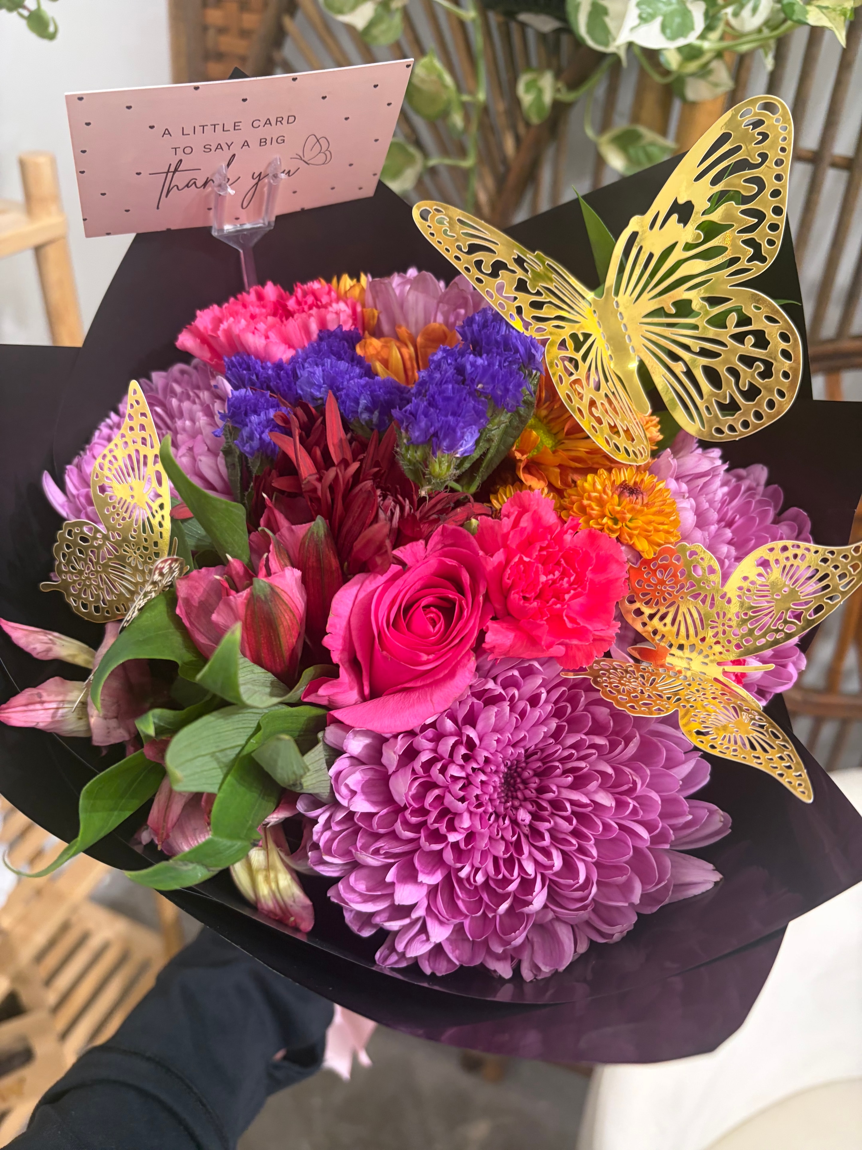 Colorful thank you bouquet with gold butterfly decorations