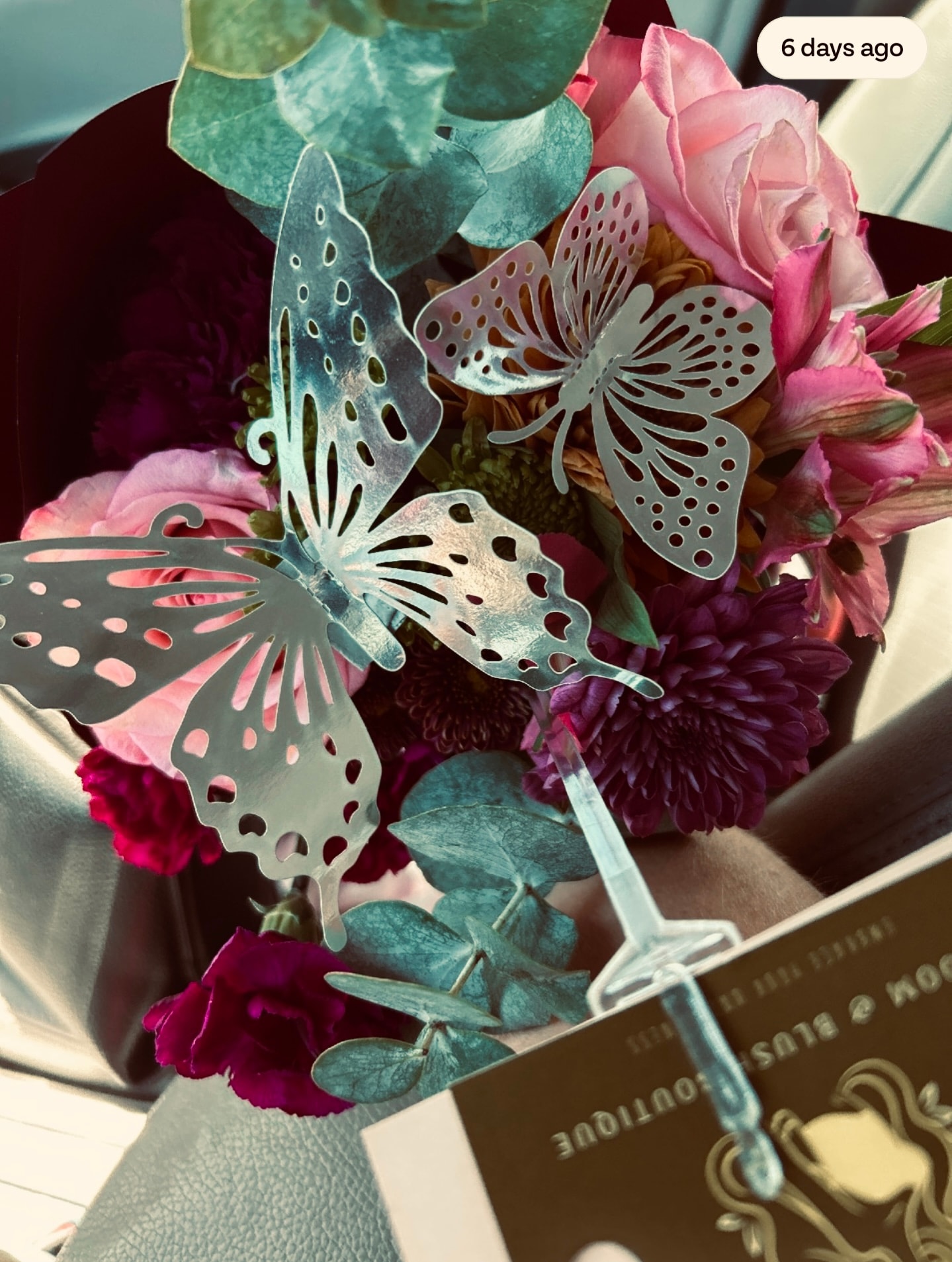 Bouquet with decorative butterflies and pink roses